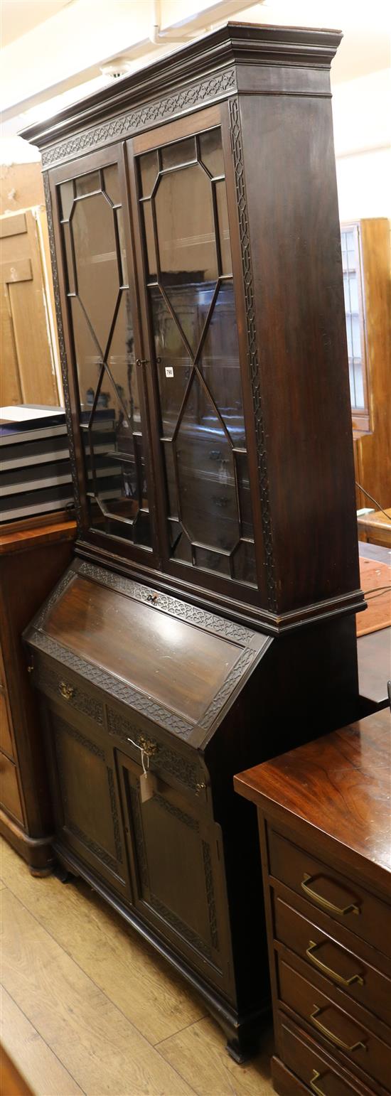 An Edwardian blind fret carved mahogany bureau bookcase W.102cm